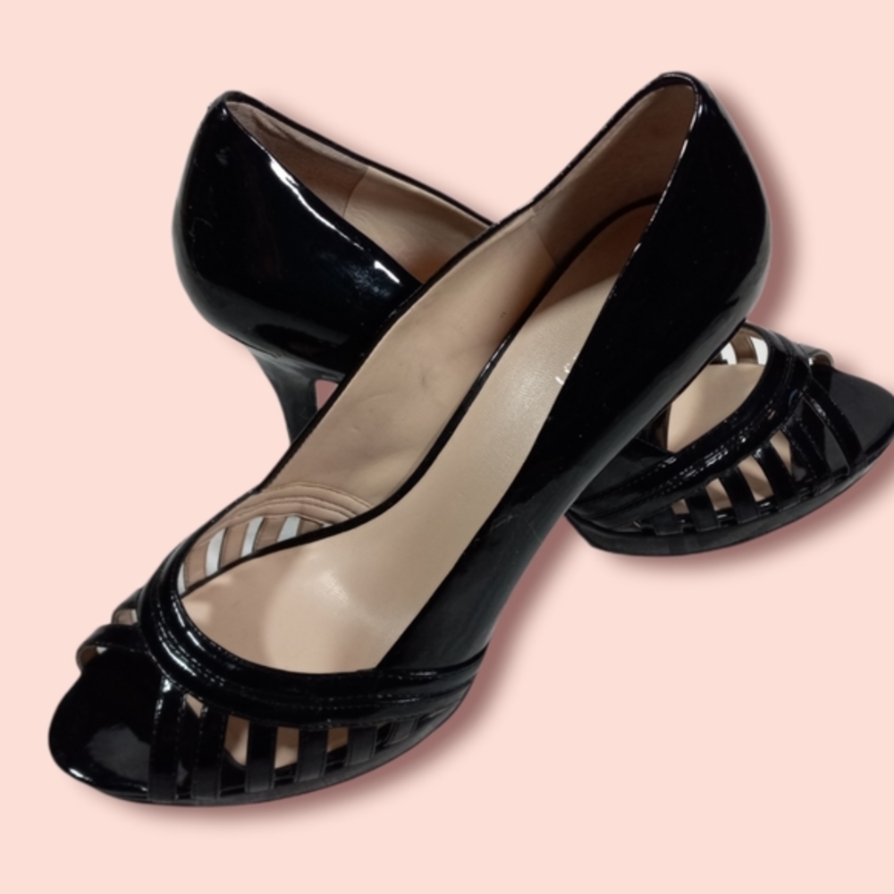 Nine West black patent faux leather peep toe heels.  Size 10M women's.